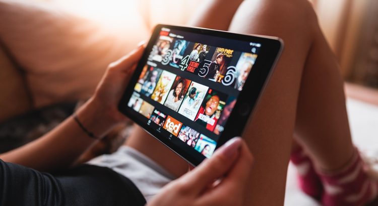 Tablet, girl, netflix — The Advantages of Watching Live Games Through Sports Broadcasting